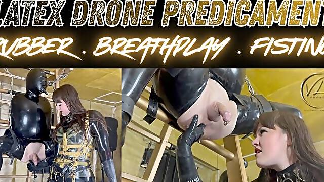 (1080P) LATEX DRONE PREDICAMENT - RUBBER . BREATHPLAY . FISTING. Vivienne lAmour puts her rubber drone through its paces, suspending it in leather and chains, legs spread and gasping for deep hard...